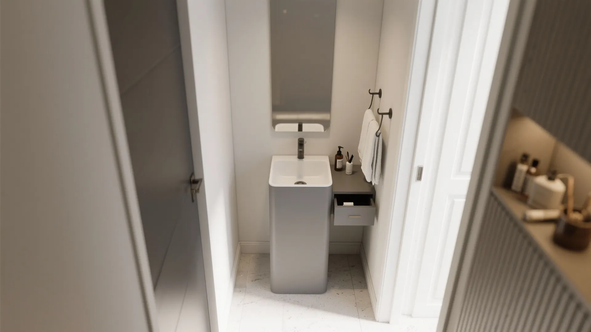 Small bathroom with grey pedestal sink narrow mirror wall light and white door in corner