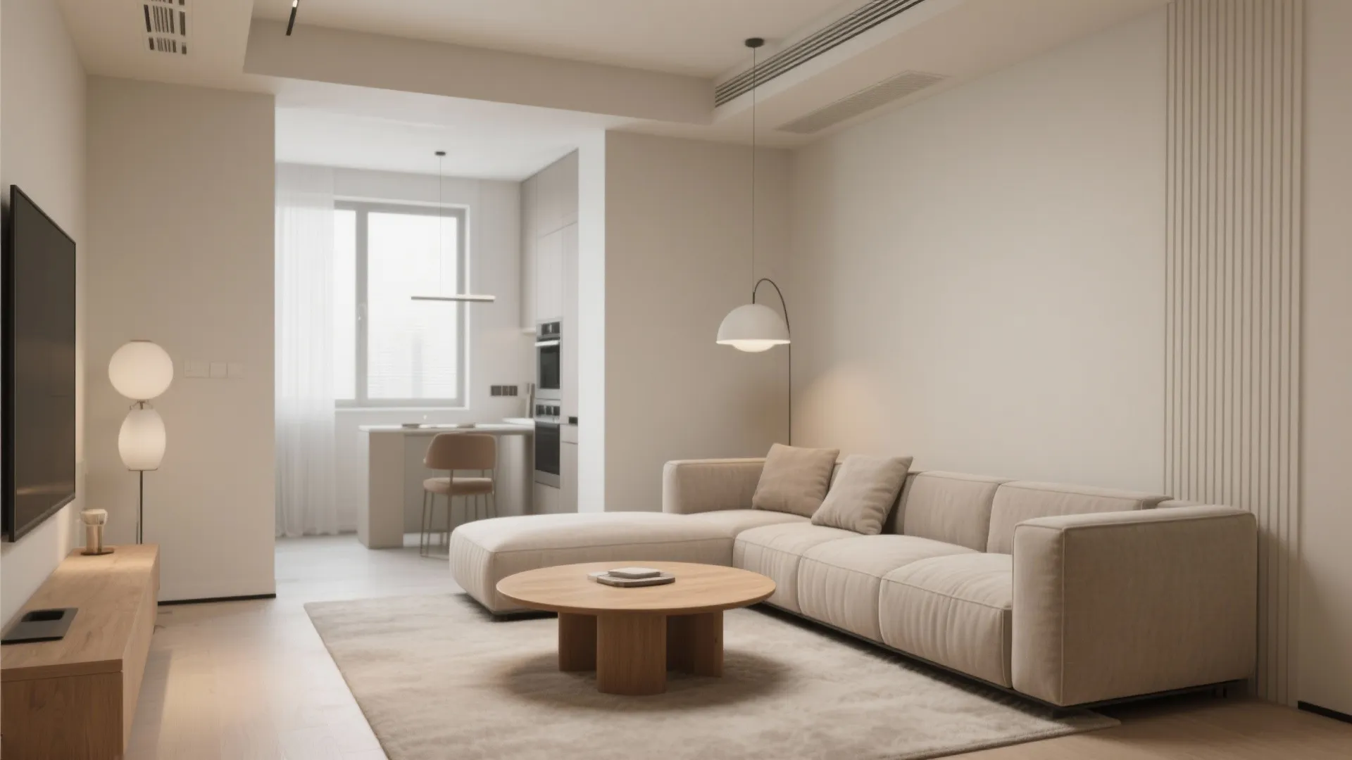 Minimalist open plan living room with large beige sofa round wood table and white ceiling light
