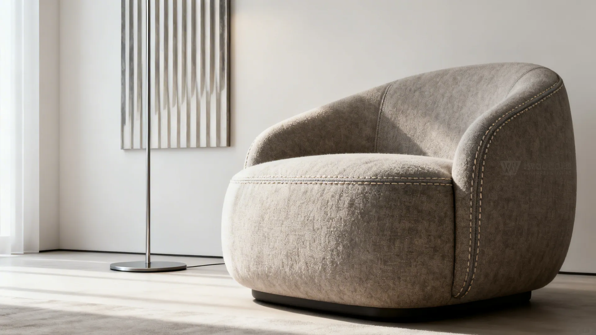 Deep-seat oversized slipper chair in a minimalist living room with tall lamp and wall art, fabric close-up.