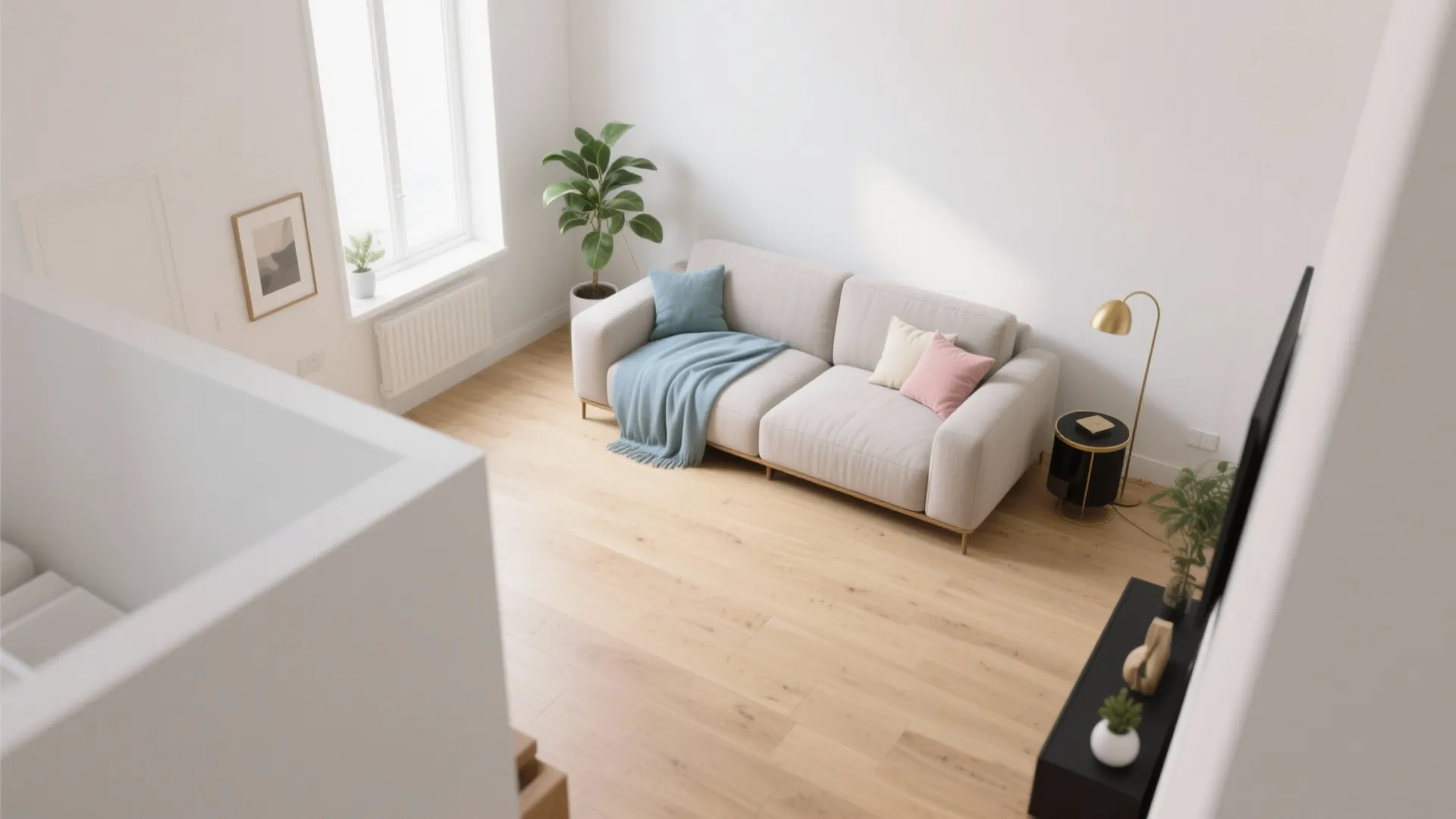 High angle view of a beige sofa with blue blanket on a light wood floor