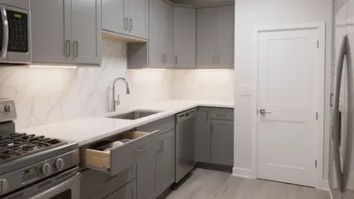 Modern Gray Kitchen with Marble Backsplash & Smart Storage