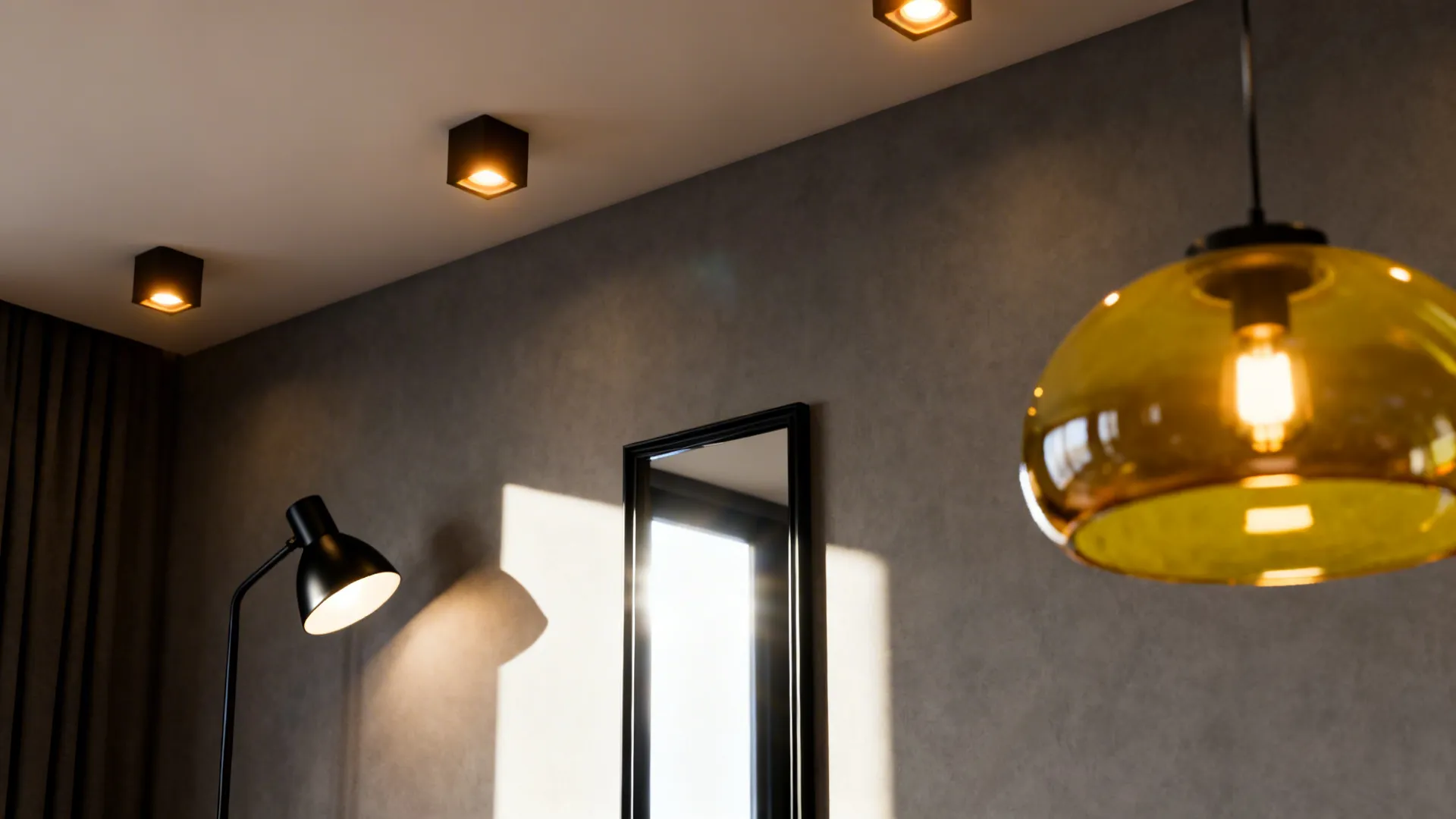 Interior room with black ceiling lights a floor lamp mirror and a yellow glass light fixture