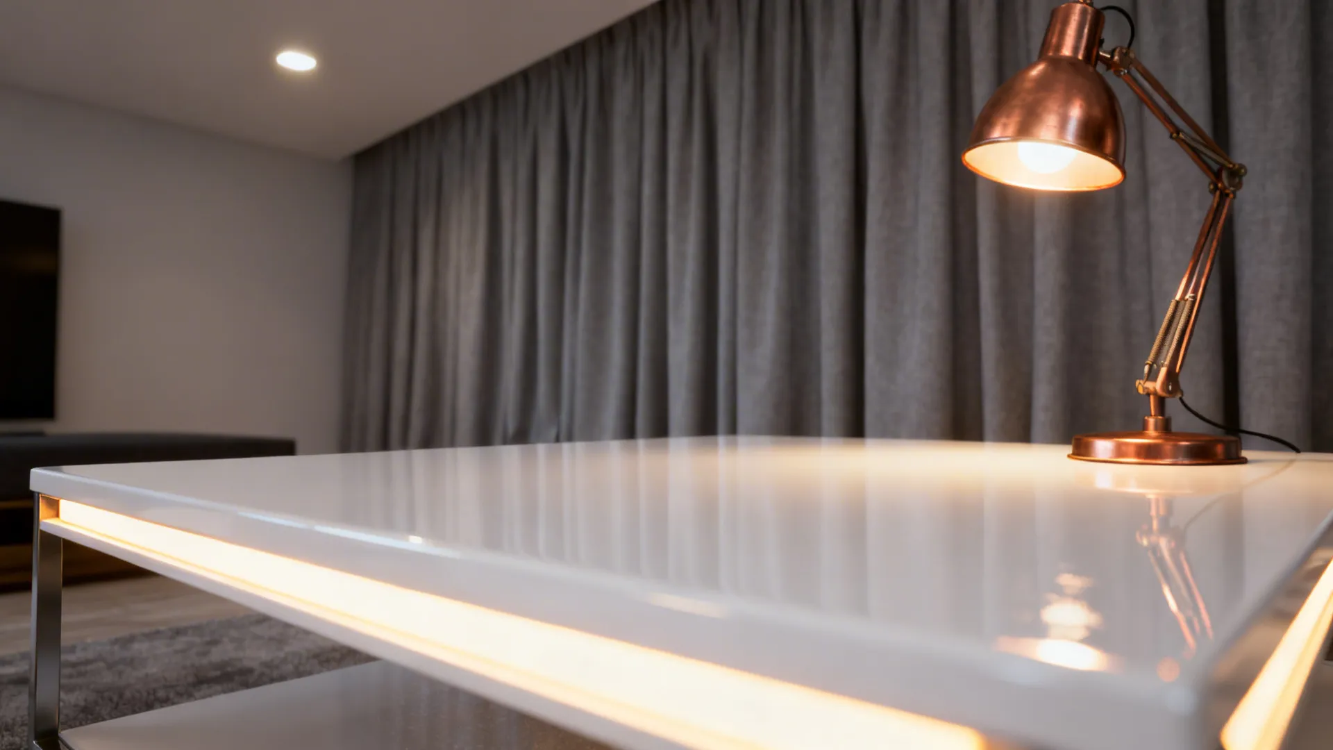 Gloss white coffee table reflecting warm LED light with grey curtains behind