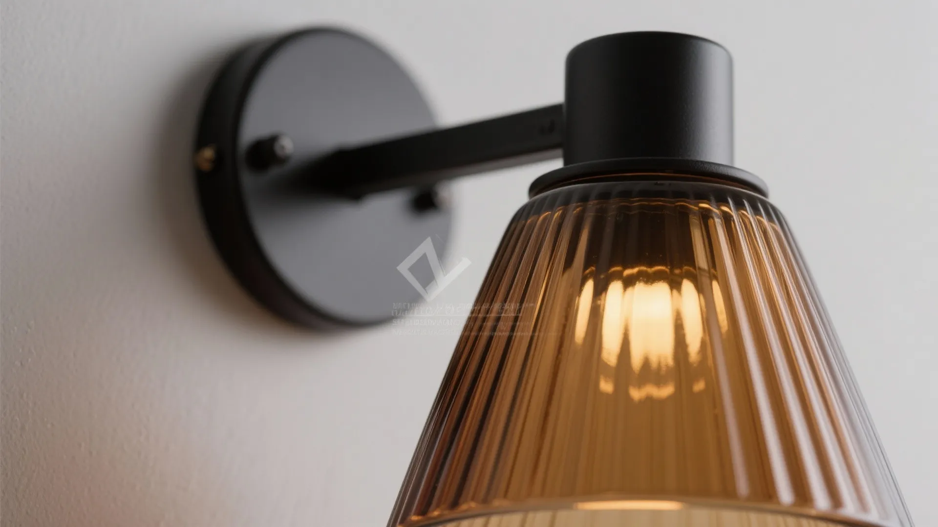 Sculptural glass-and-metal sconces for layered texture