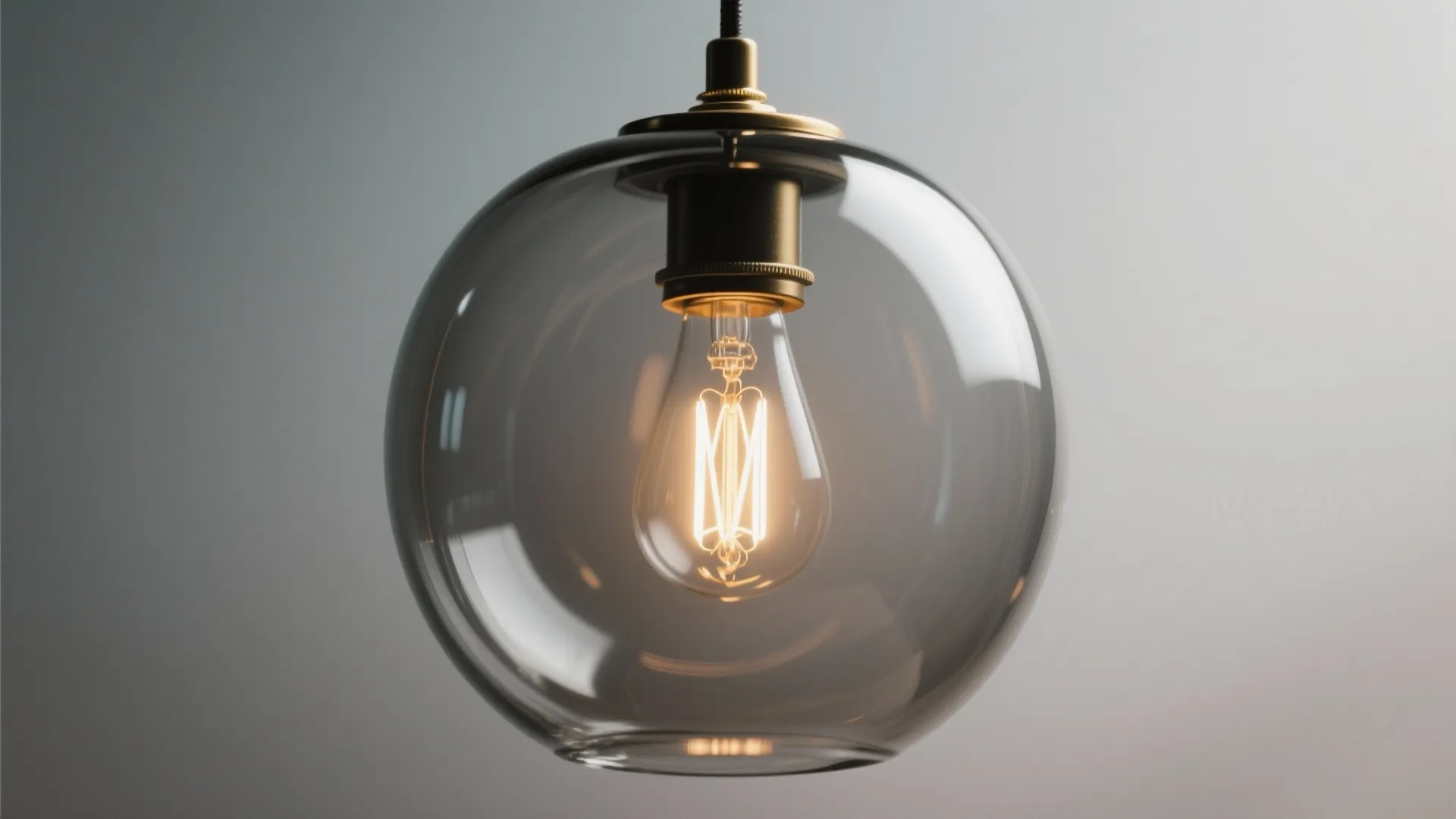 5) Clear or smoked glass pendants for airy minimalism