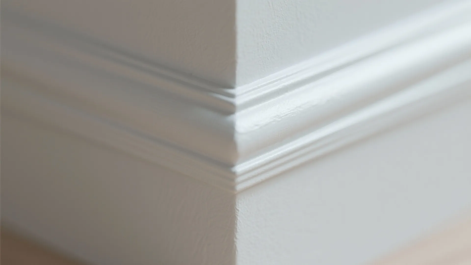 Macro view of a smooth painted corner with no visible overlap lines and an even eggshell finish.