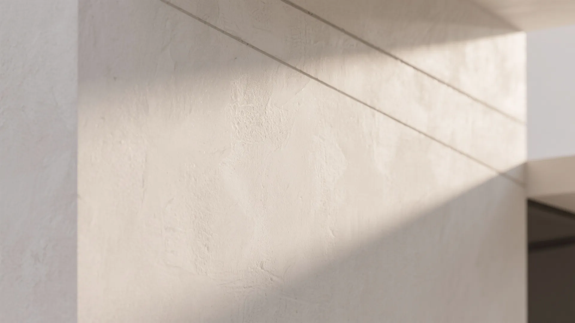 Smooth plaster wall in neutral tones with flawless finish