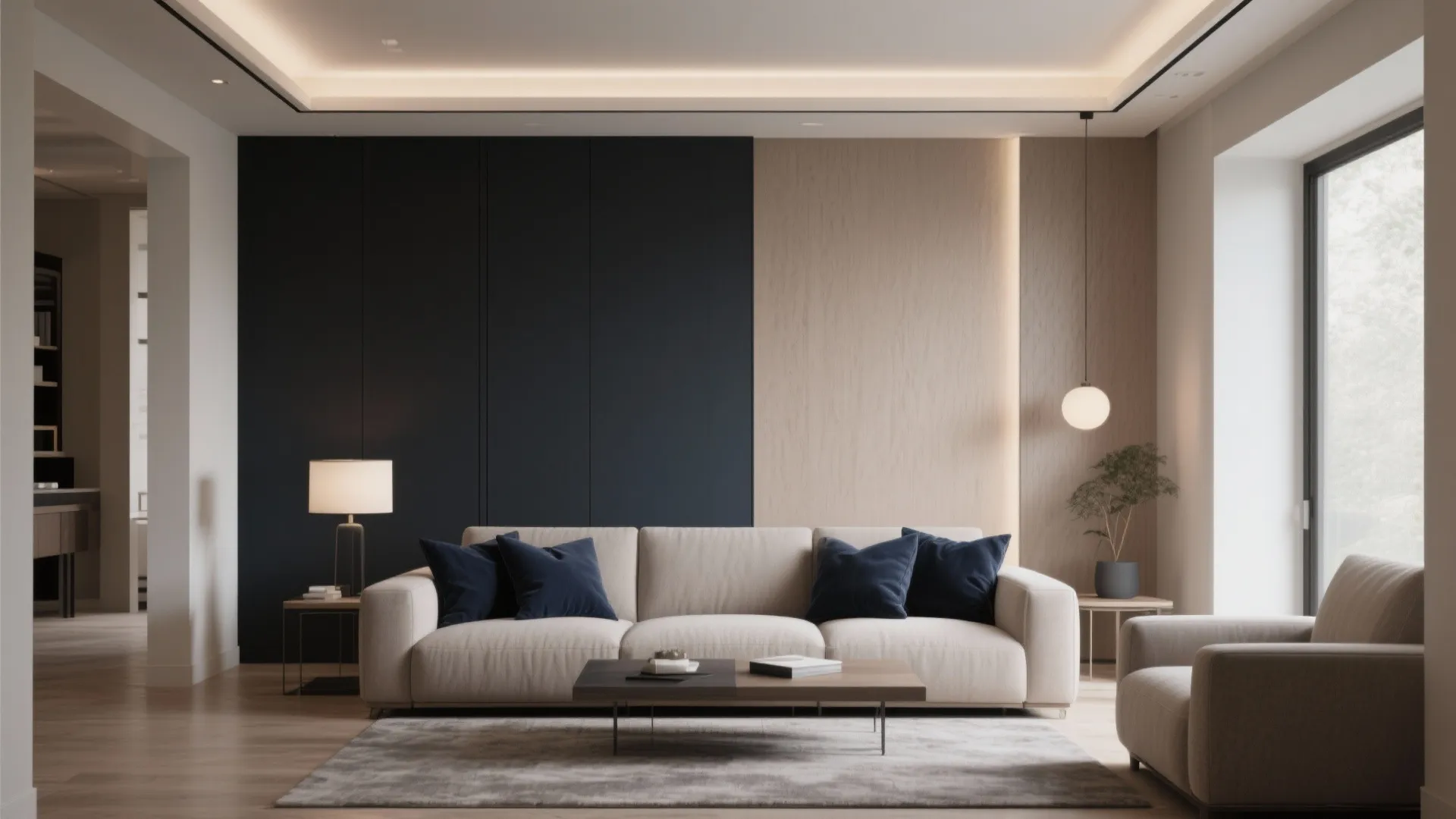 Minimalist living room with navy wall panel and beige sofa plus light fixture and rug