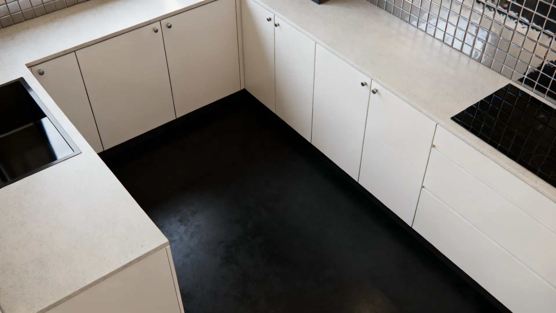 Top-down layout view of a compact galley with soft-white cabinets and a black floor.