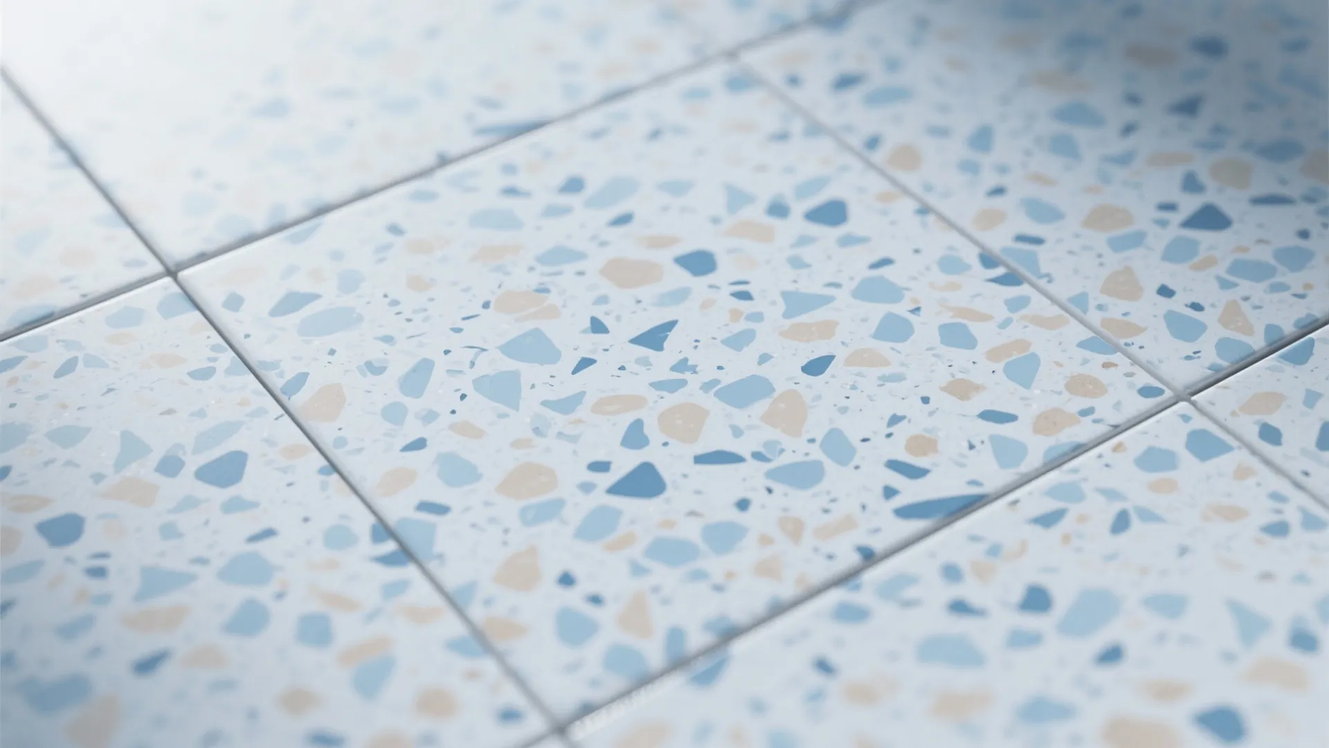 Close up view of blue and beige speckled floor tiles in a modern bathroom design setting