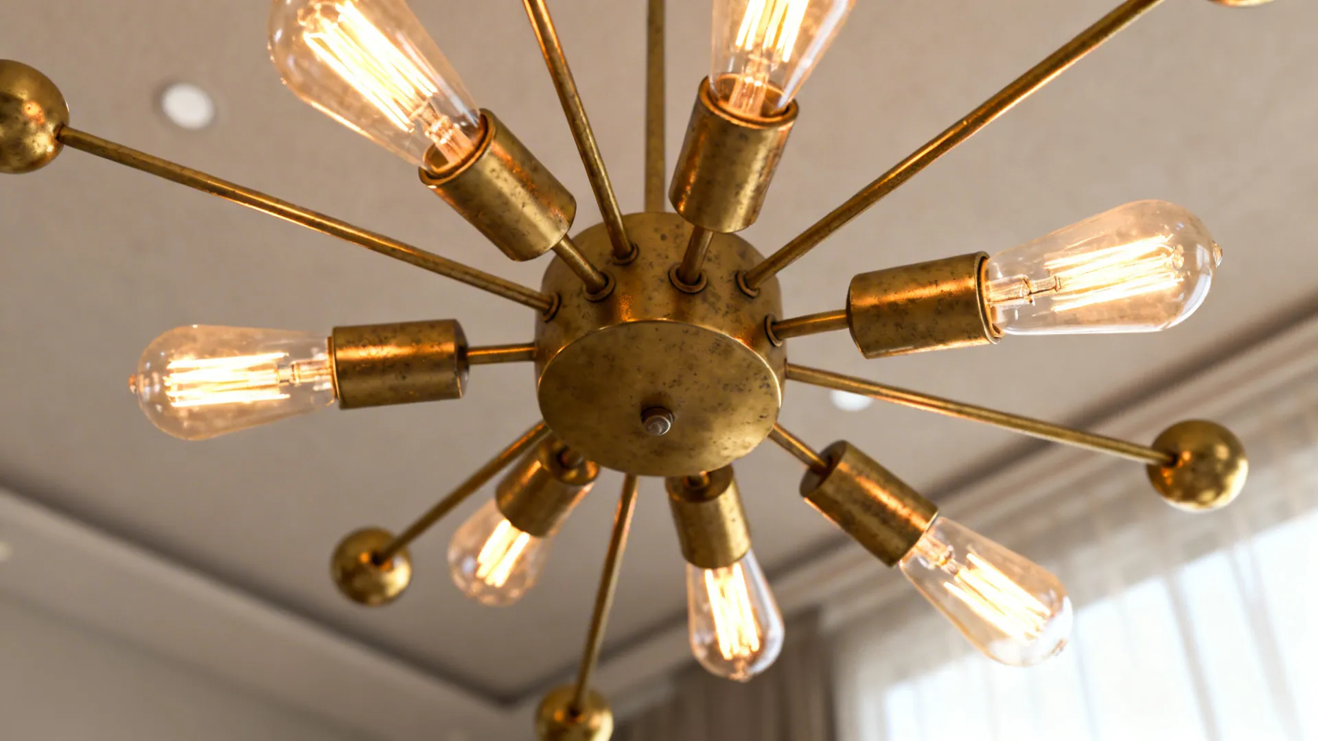 Close-up of a brass sputnik chandelier with exposed filament bulbs