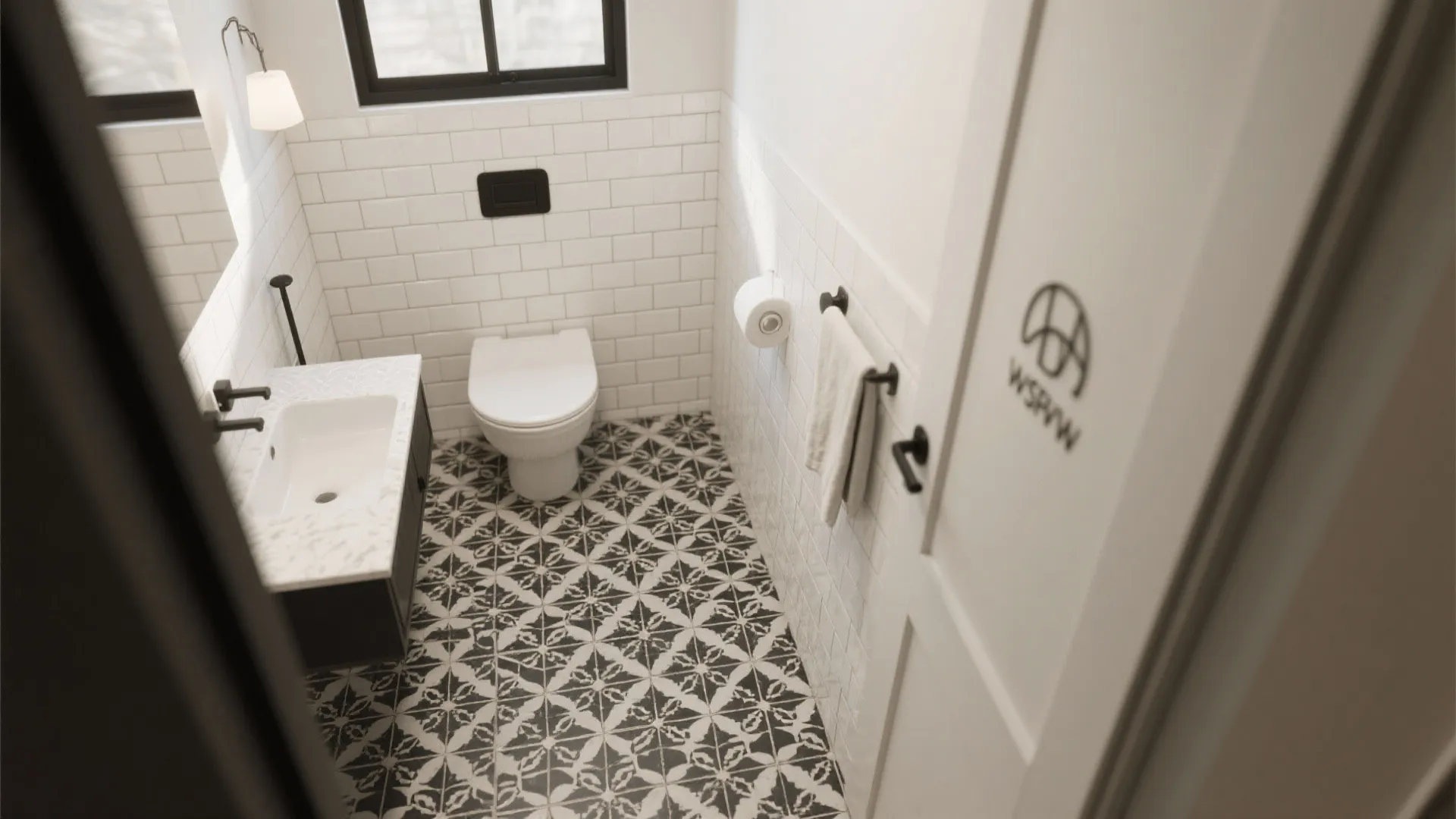 Top view of a small bathroom featuring black and white patterned floor tiles and vanity