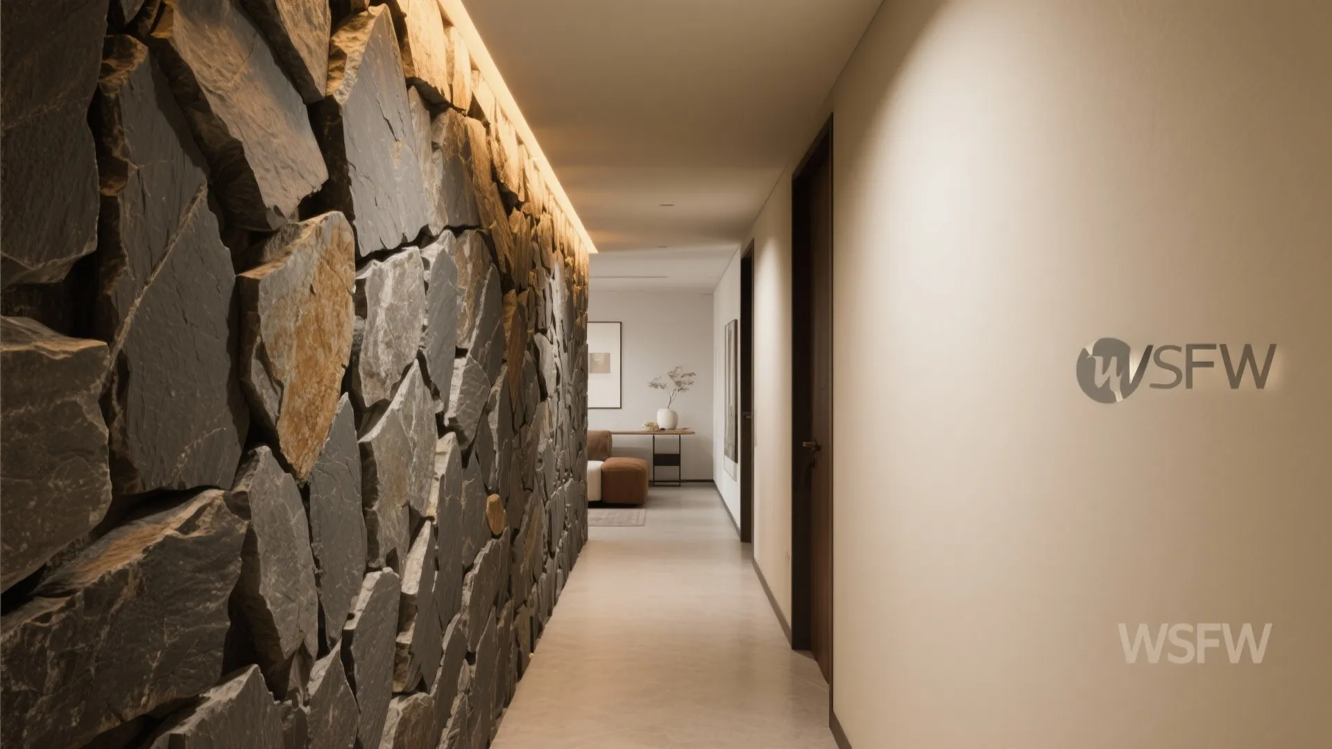 Long hallway featuring a large natural stone accent wall with warm hidden ceiling light strip