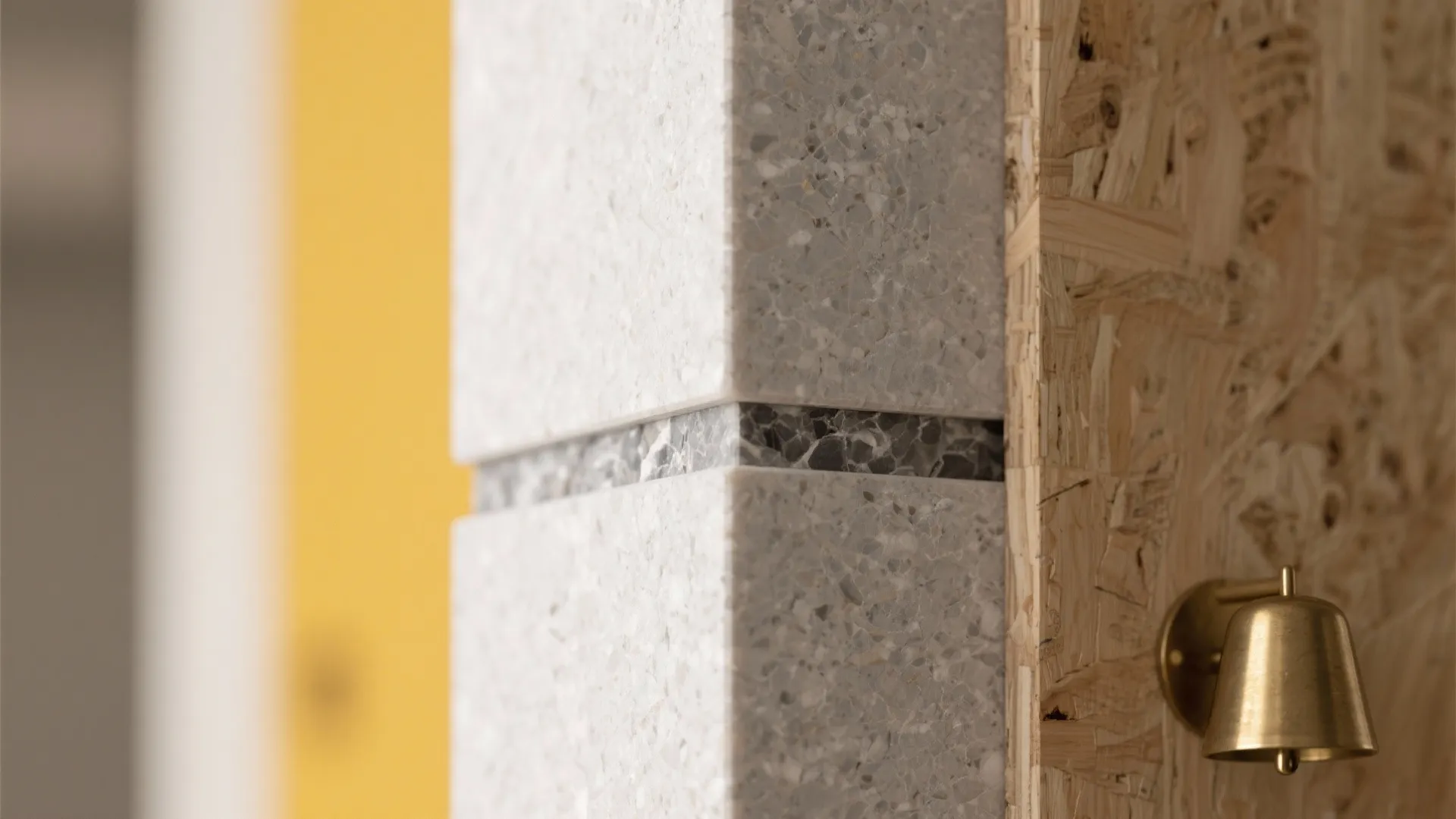 Close-up of matte quartz pilaster cladding with crisp edge and soft daylight texture.