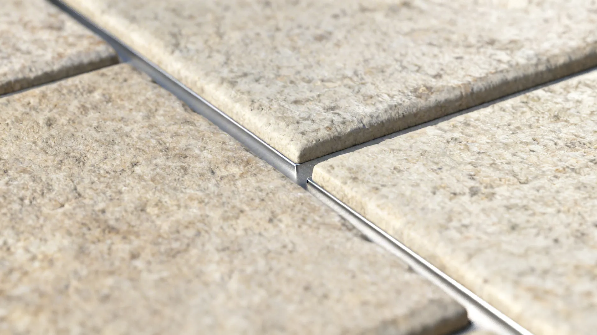 Macro of stone-composite mosaic with textured face and neat grout line.