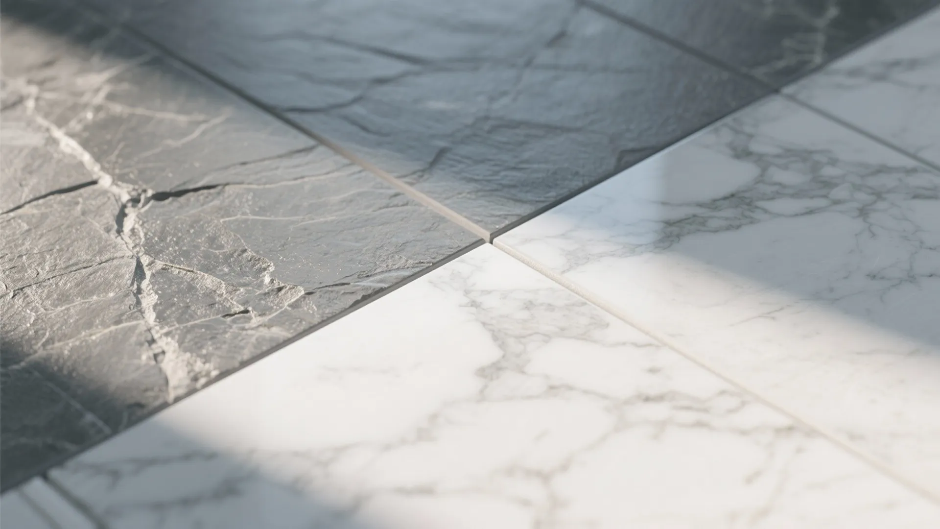 Macro comparison of honed marble-look porcelain veining and soft riven slate-look texture.