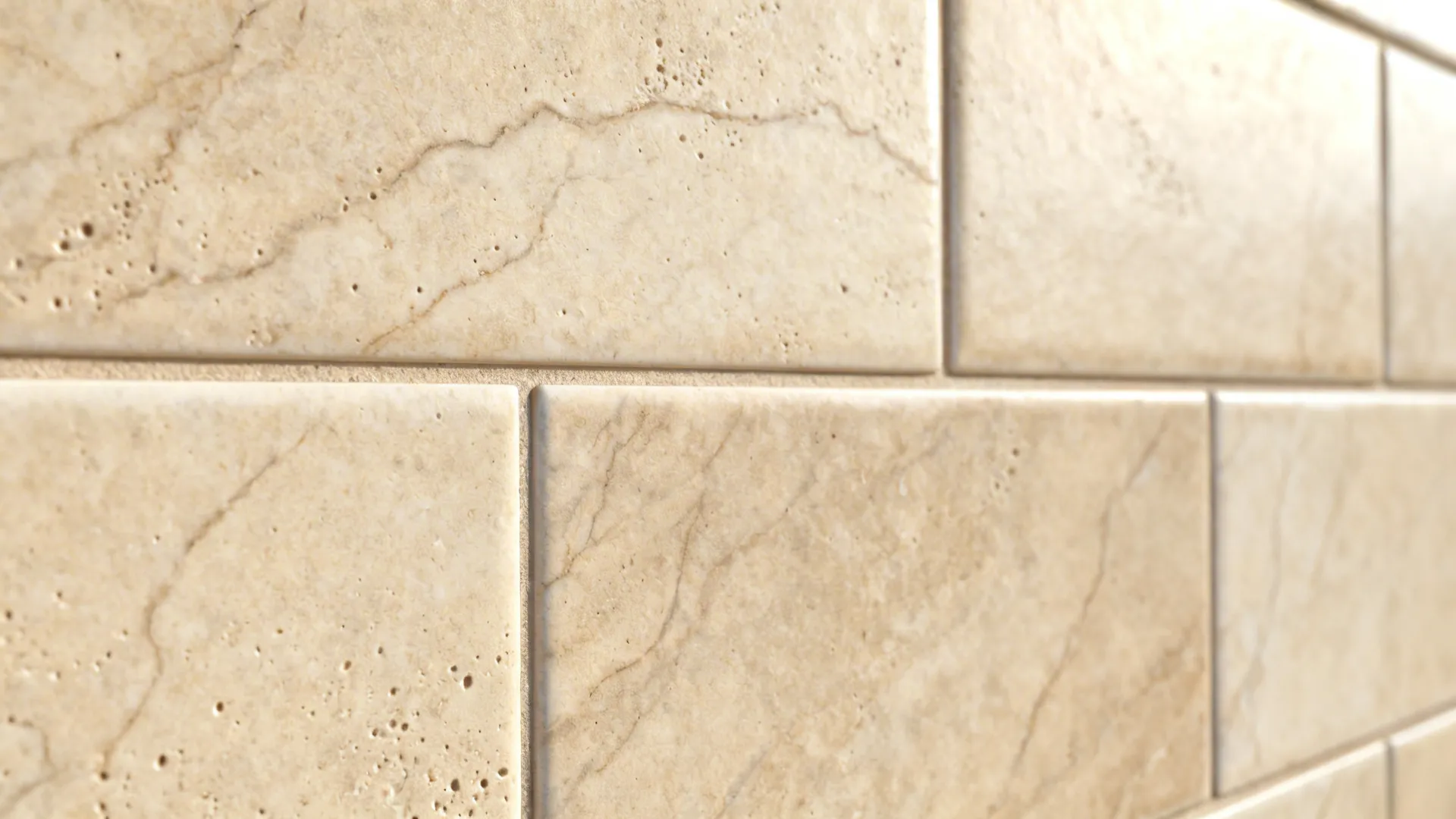 Macro of stone-look porcelain backsplash with subtle veining and matte texture.