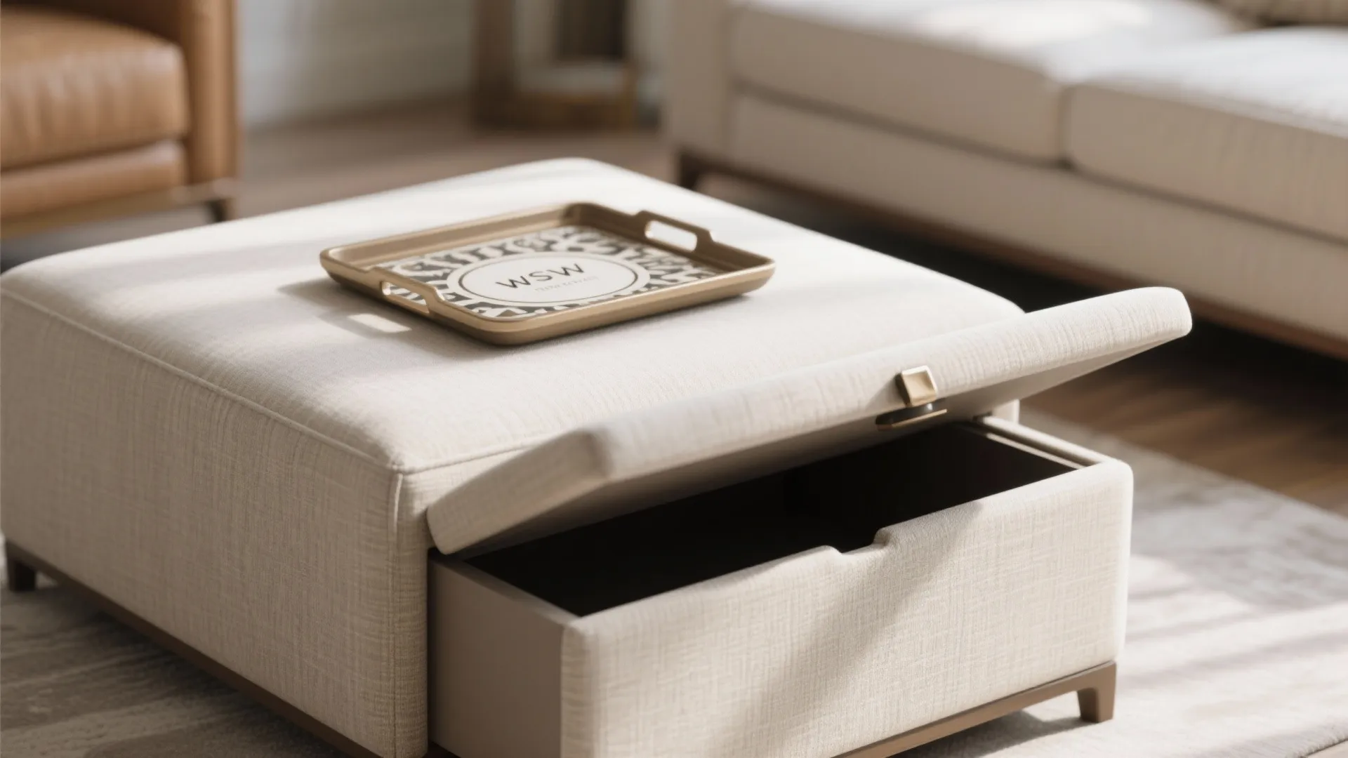 Close up of a beige fabric footrest with an open storage drawer and a gold tray