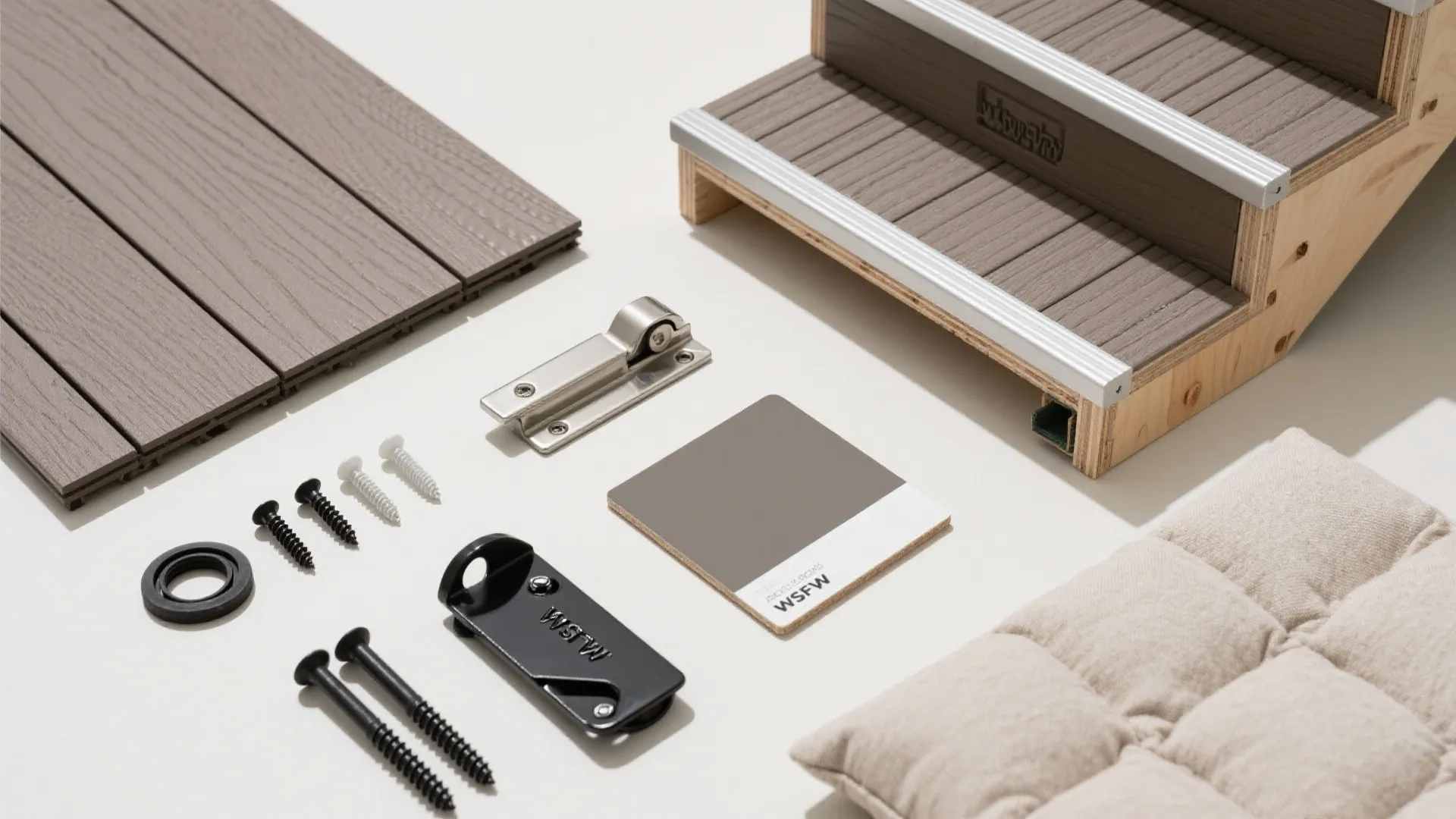 Various building materials including wood planks screws and small stair model for home interior design