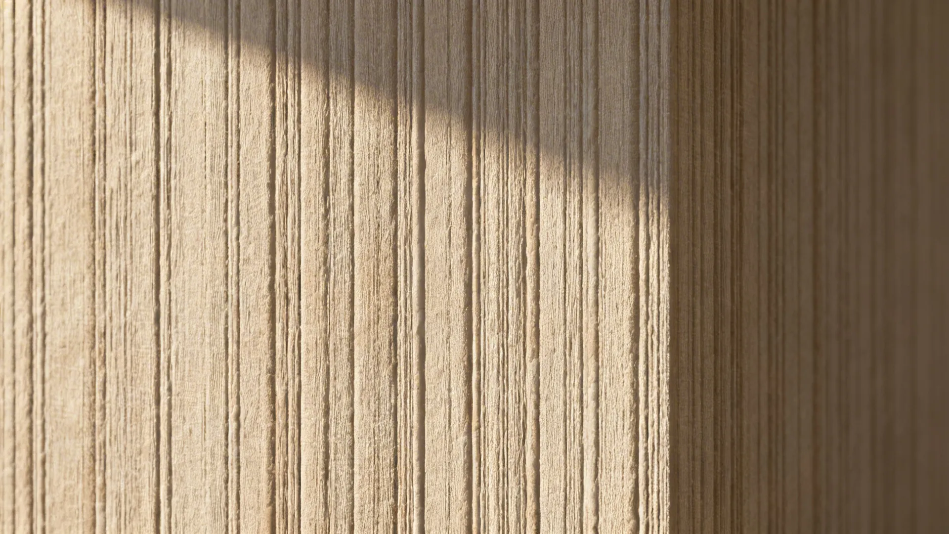 Macro of taupe strié wall showing fine vertical brush lines in soft light.