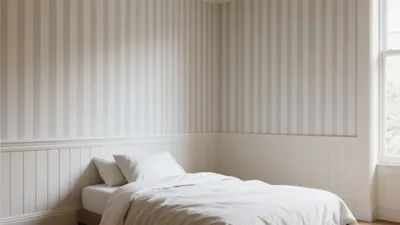 Serene Bedroom with Striped Wallpaper and White Wainscoting
