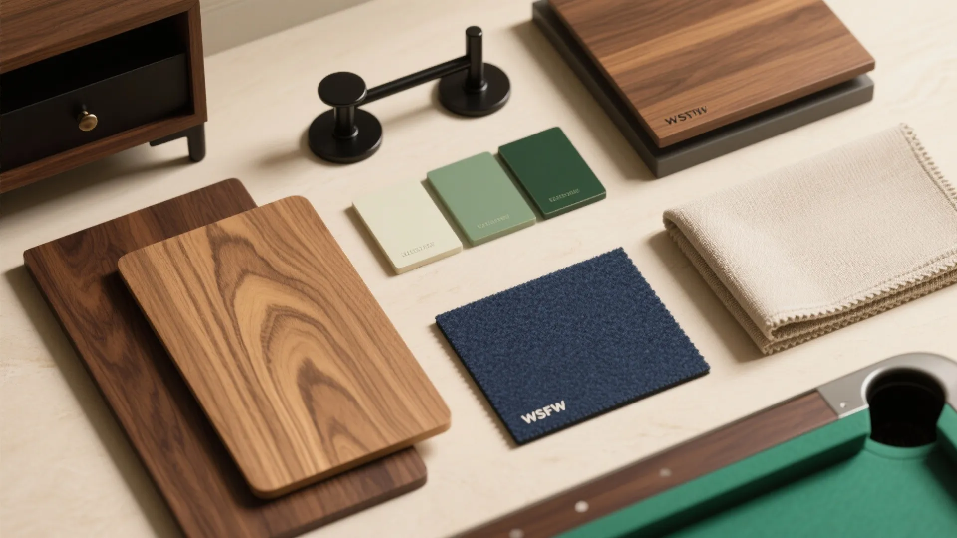 Interior design material board with wood samples fabric swatches color tiles and black cabinet hardware
