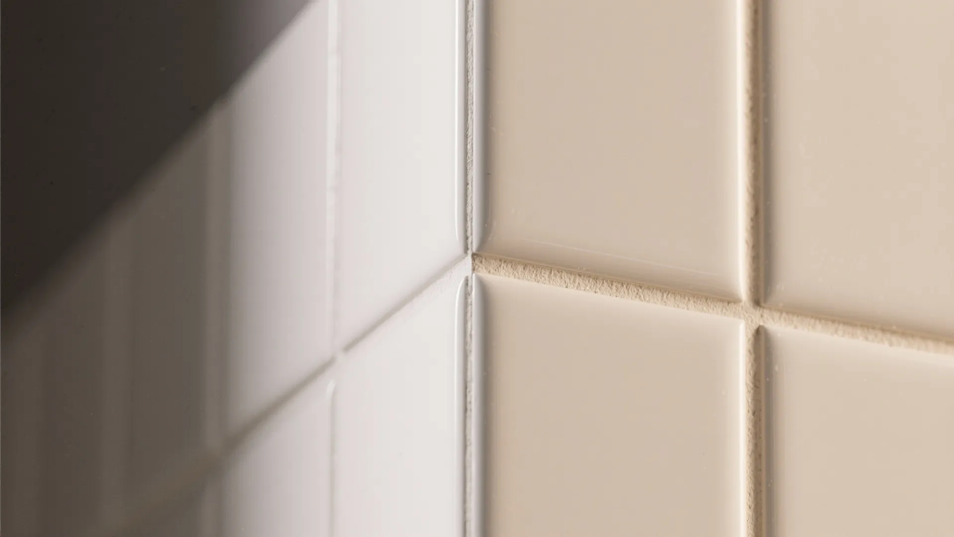 Close up view of cream square wall tiles with clean grout lines for home kitchen