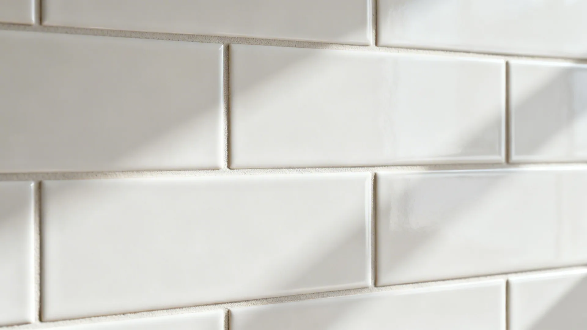 Macro view of matte subway tiles with precise 1/16-inch color-matched grout joints.