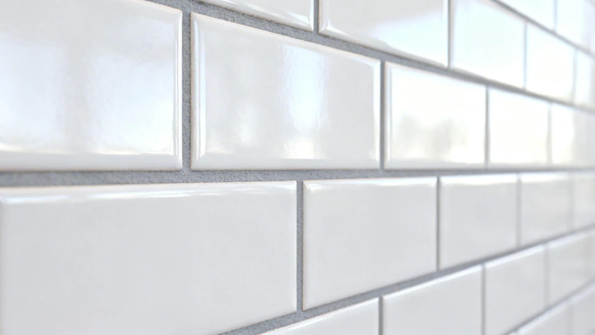Close up view of white rectangular wall tiles with grey grout lines in a bright kitchen
