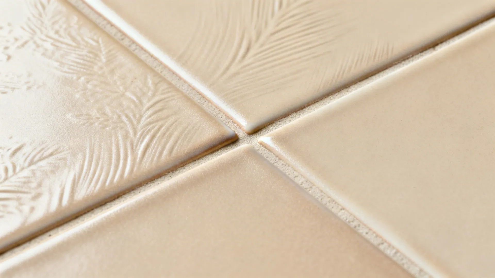 Macro view of satin-sheen subway tiles showing subtle relief and tight tone-on-tone grout.