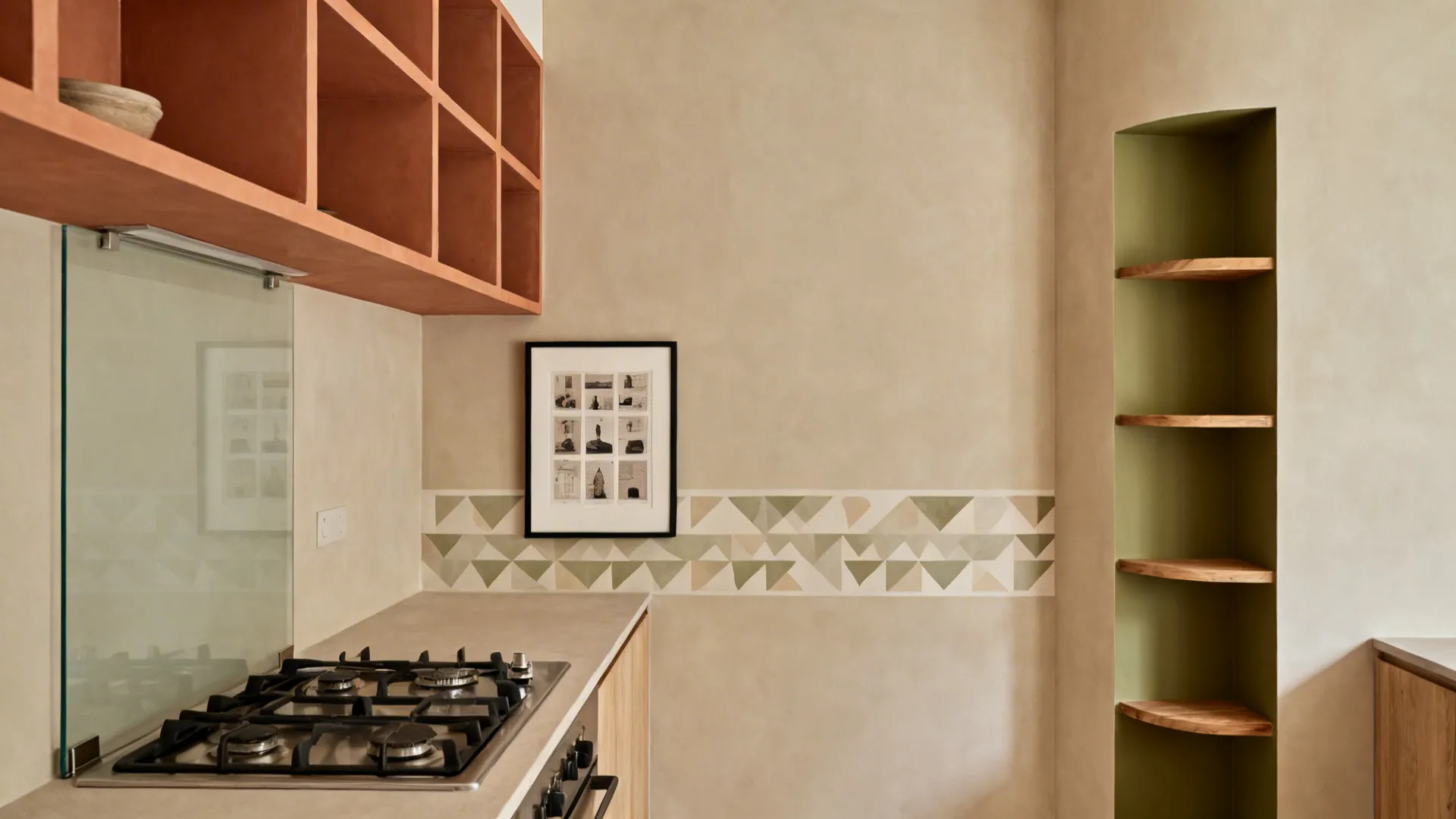 Compact warm minimalist kitchen combining color block, glass panel, print grid, mural band, and olive niche.