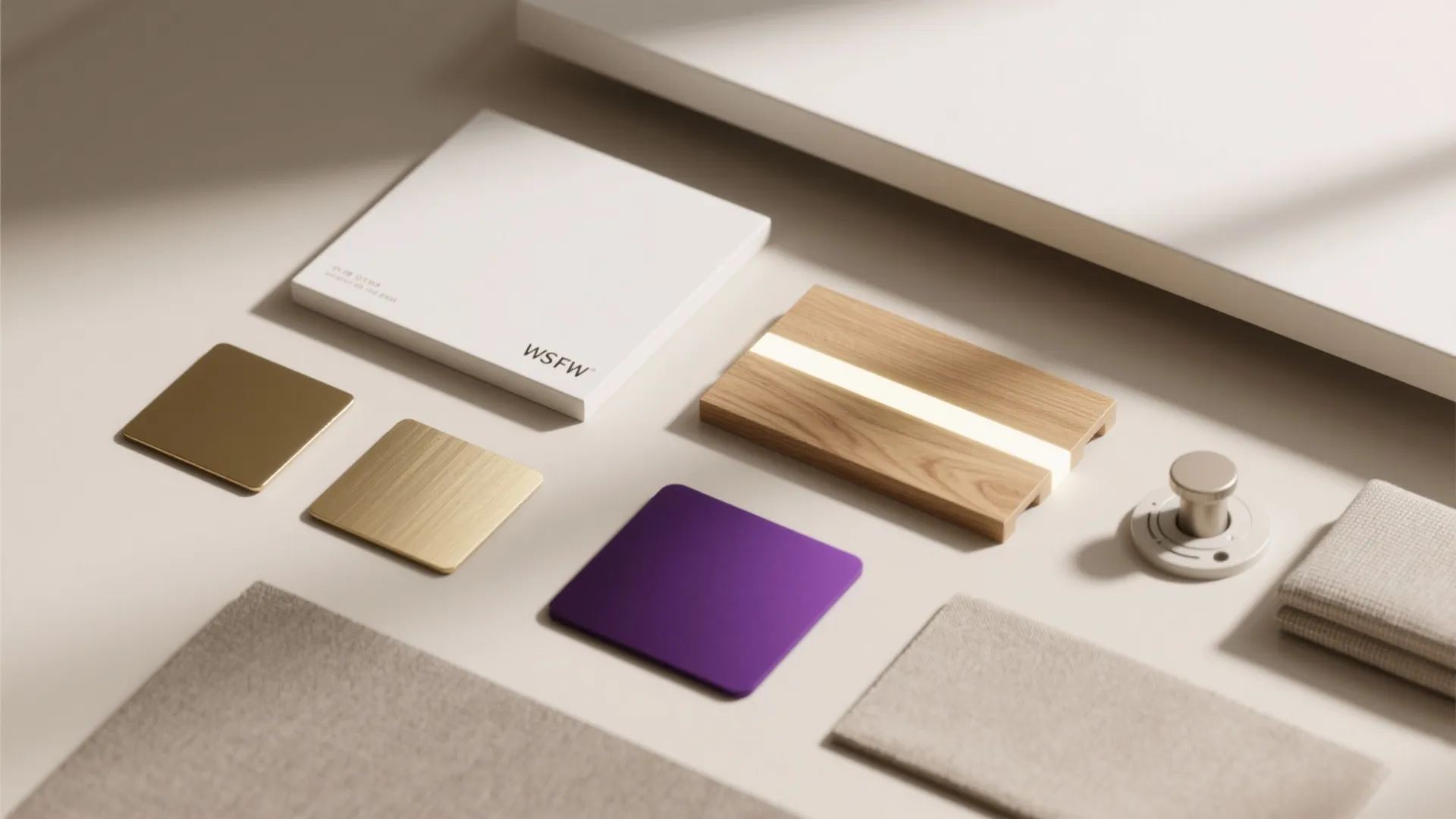 Interior design material board with wood samples fabric pieces metal plates and purple color square