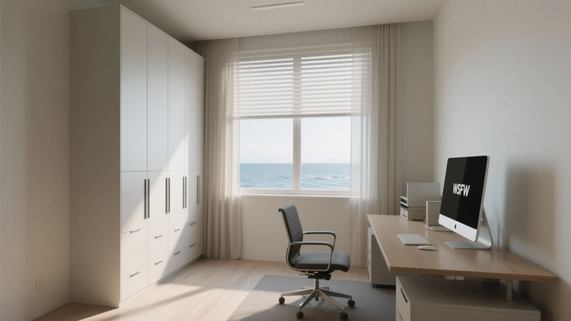 Home office with white wardrobe wooden desk black chair computer and windows showing the blue ocean