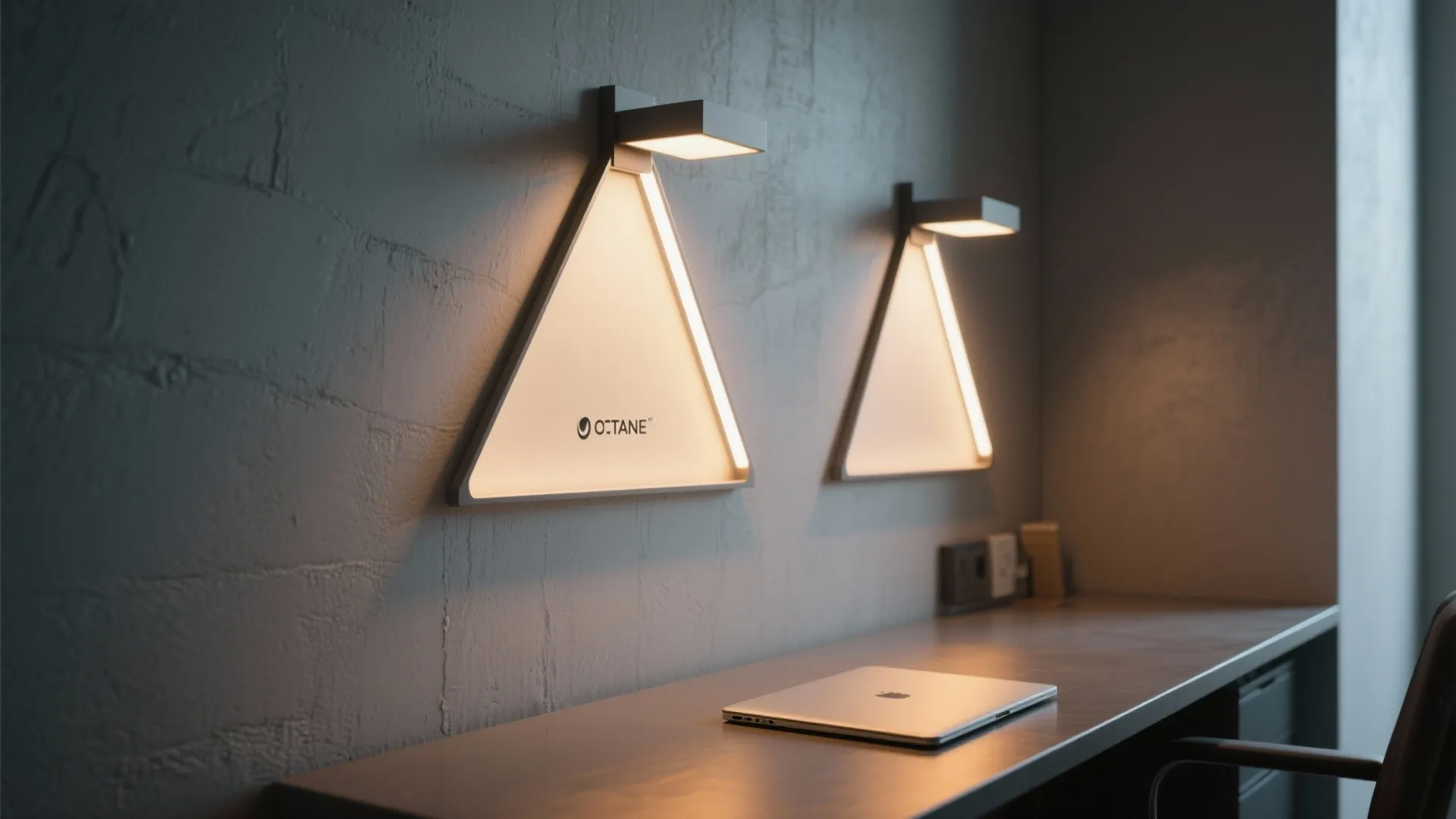 Triangle wall lights above a dark desk with a laptop in a modern home office