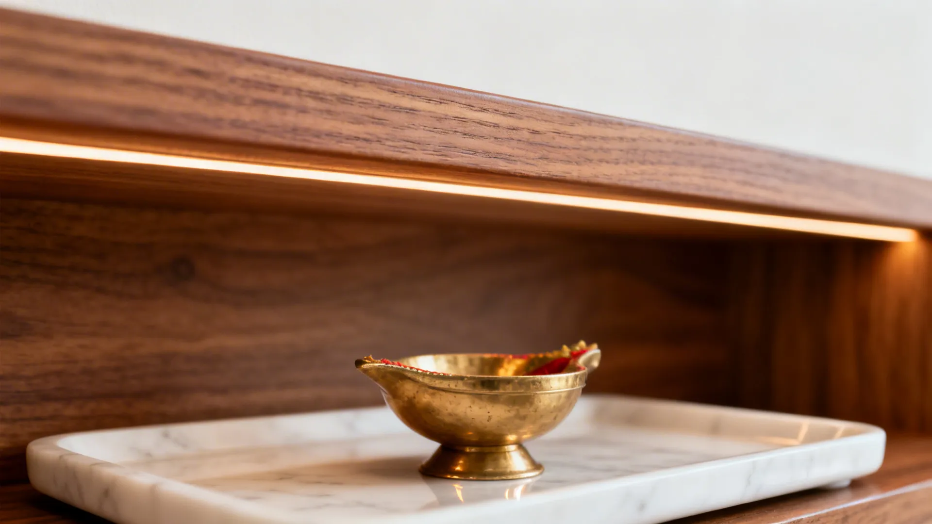 Macro detail of teak shelf with matte PU and integrated warm LED cove.