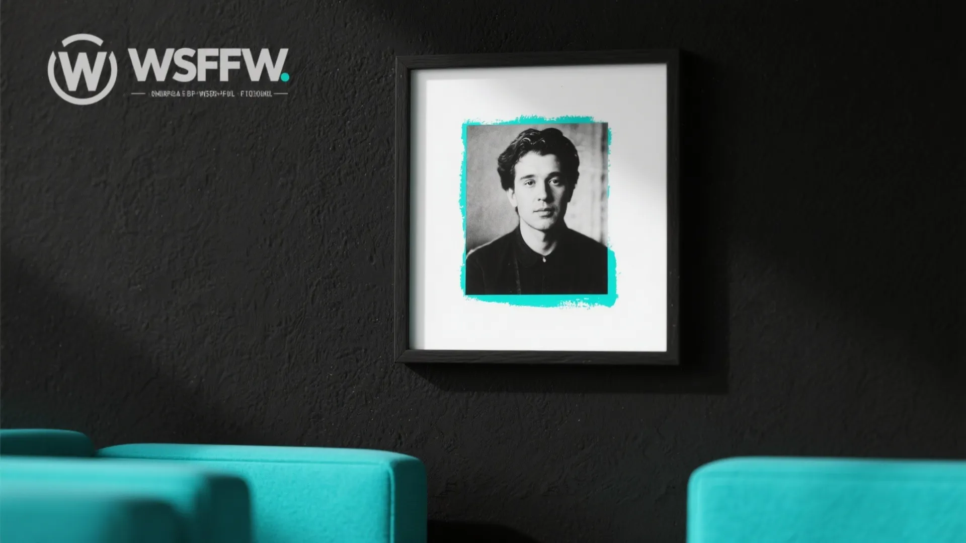 Black textured wall featuring a framed portrait with teal border and matching teal blue furniture
