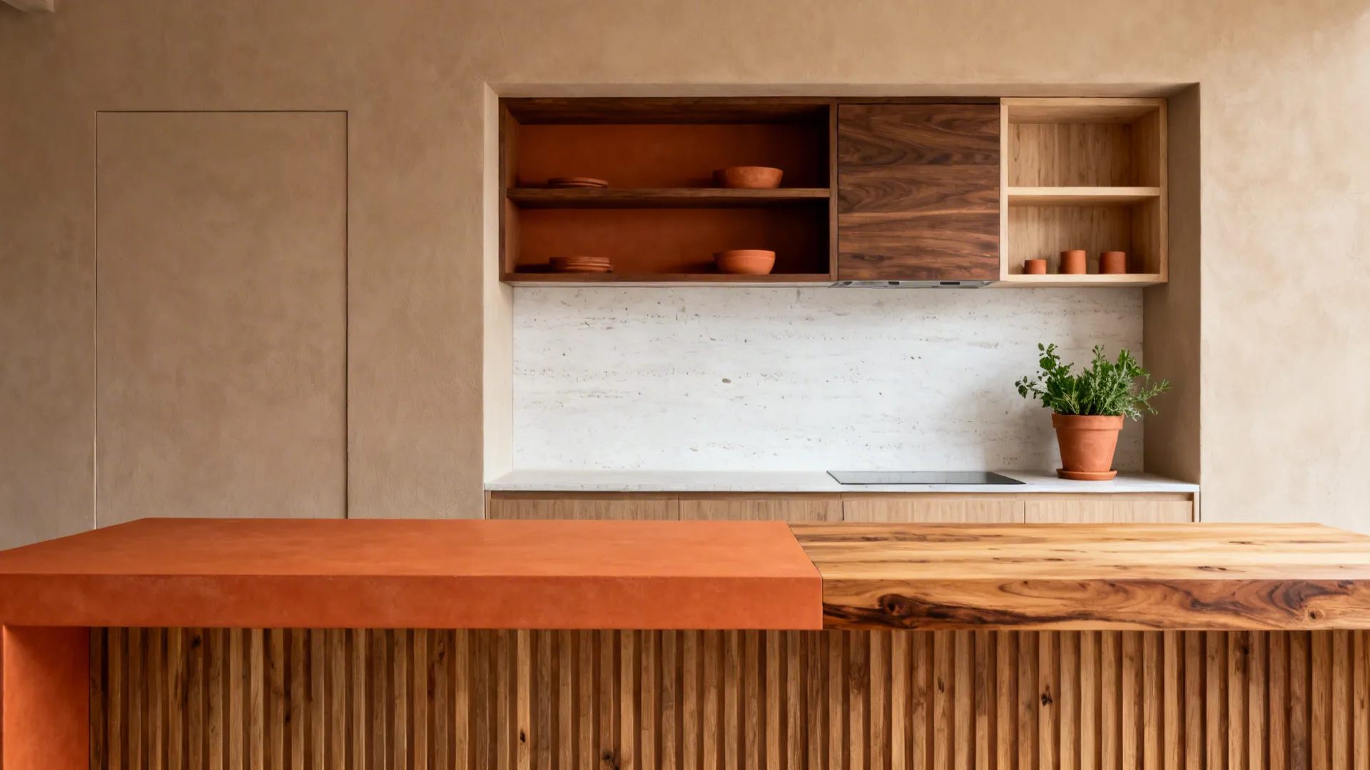 Burnt orange countertop paired with oak butcher block and terracotta tones in a warm kitchen.