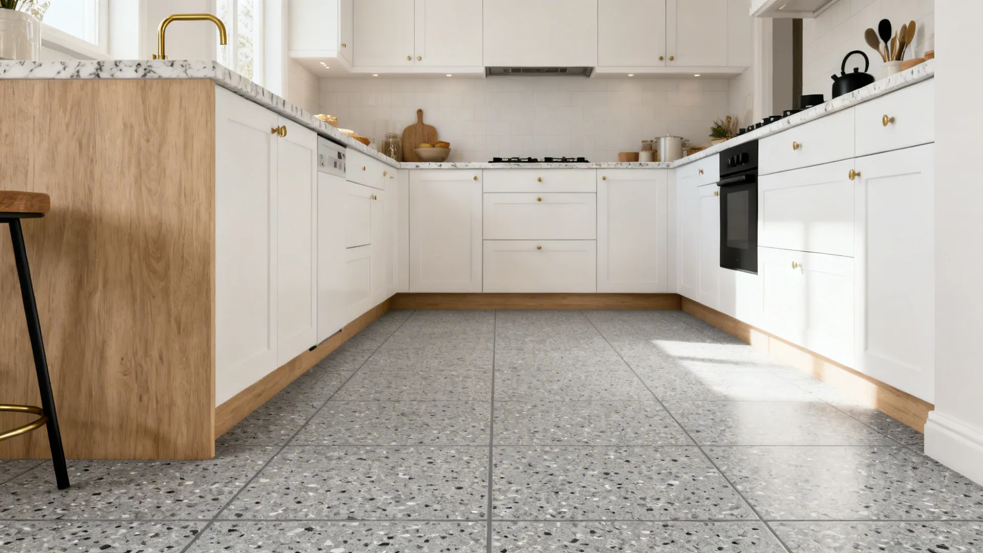 Modern kitchen with grey terrazzo-look porcelain tiles and subtle speckling under soft daylight.
