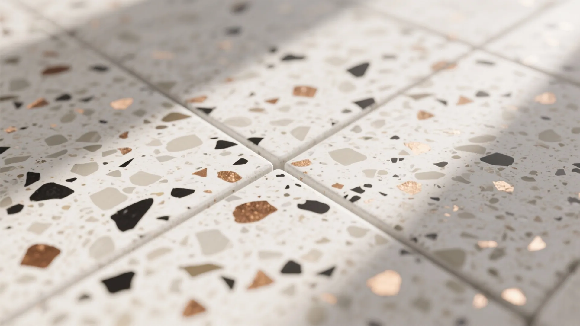 Close up view of white floor tiles with colorful stone patterns and soft natural sunlight