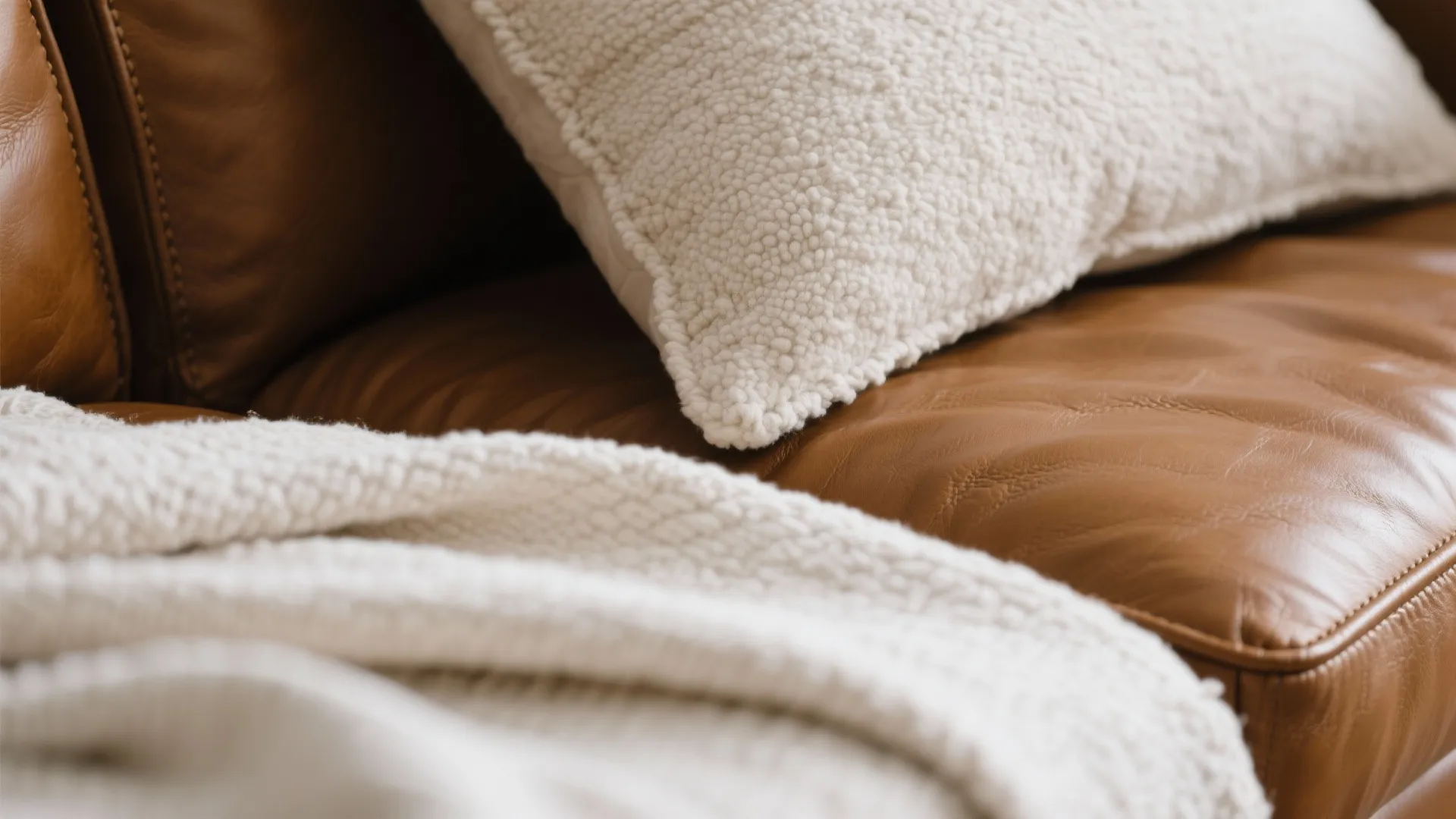 1) Light-and-texture layering around a brown sofa