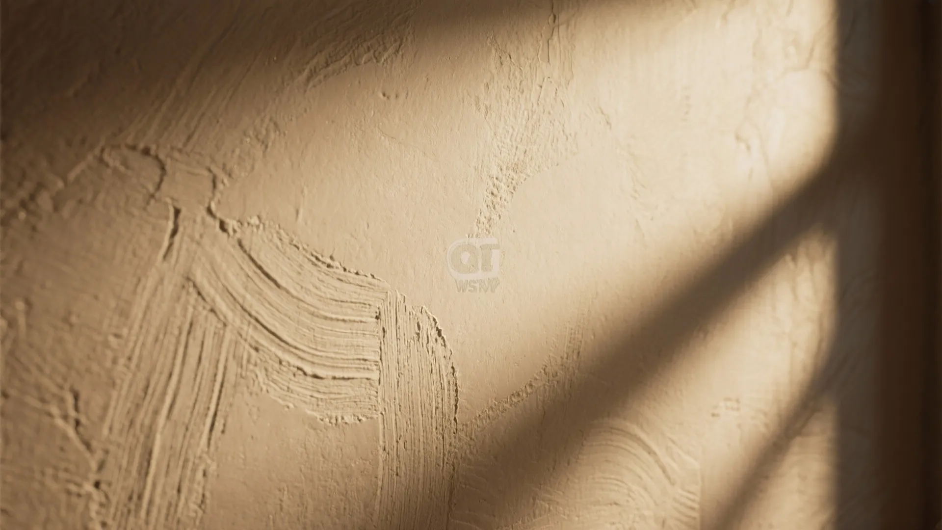 Close-up of textured plaster and satin paint with up-lighting highlighting surface detail.
