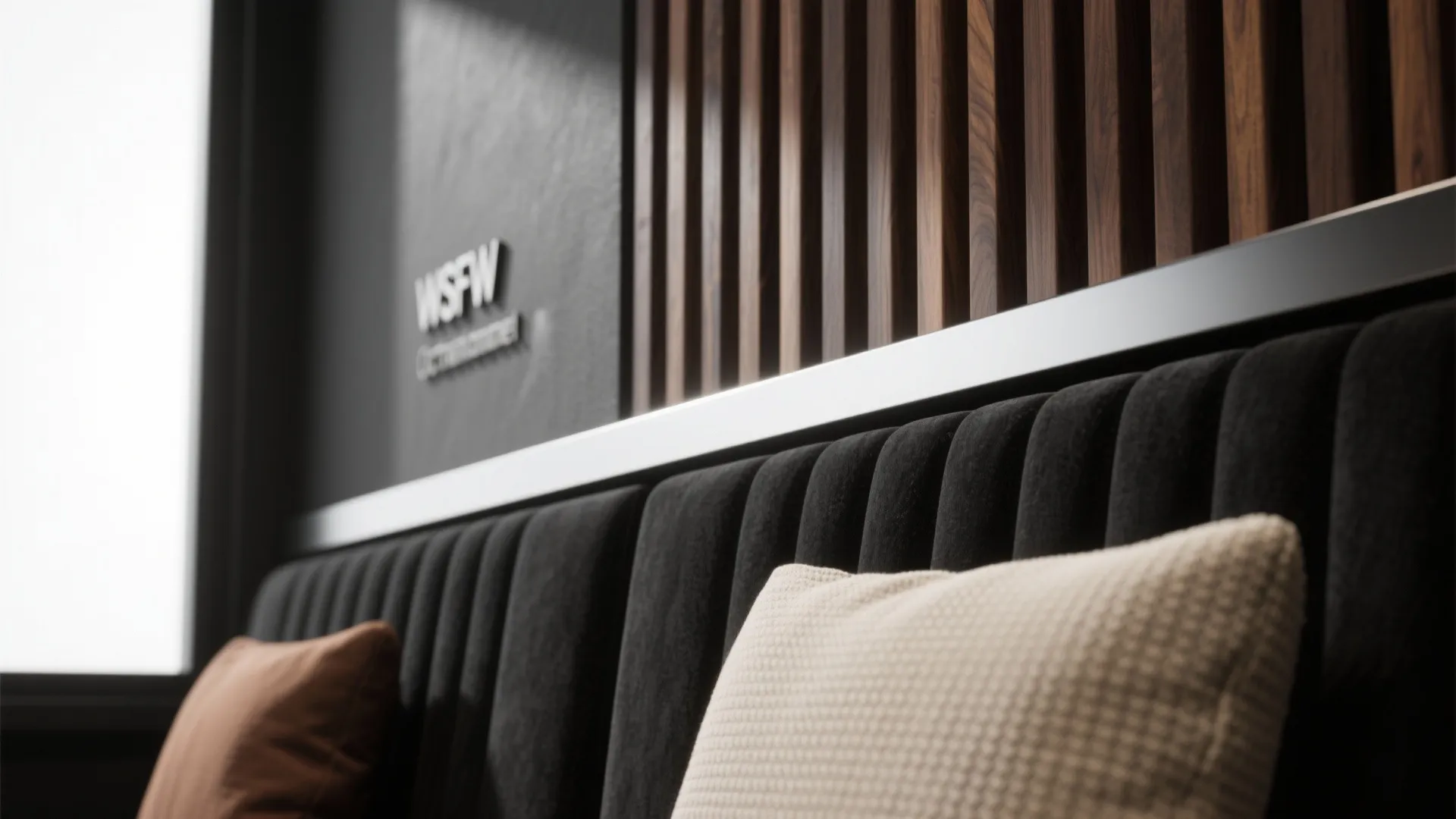 Macro of matte black wall, ribbed wood slats, powder-coated steel, and bouclé fabric under raking light.