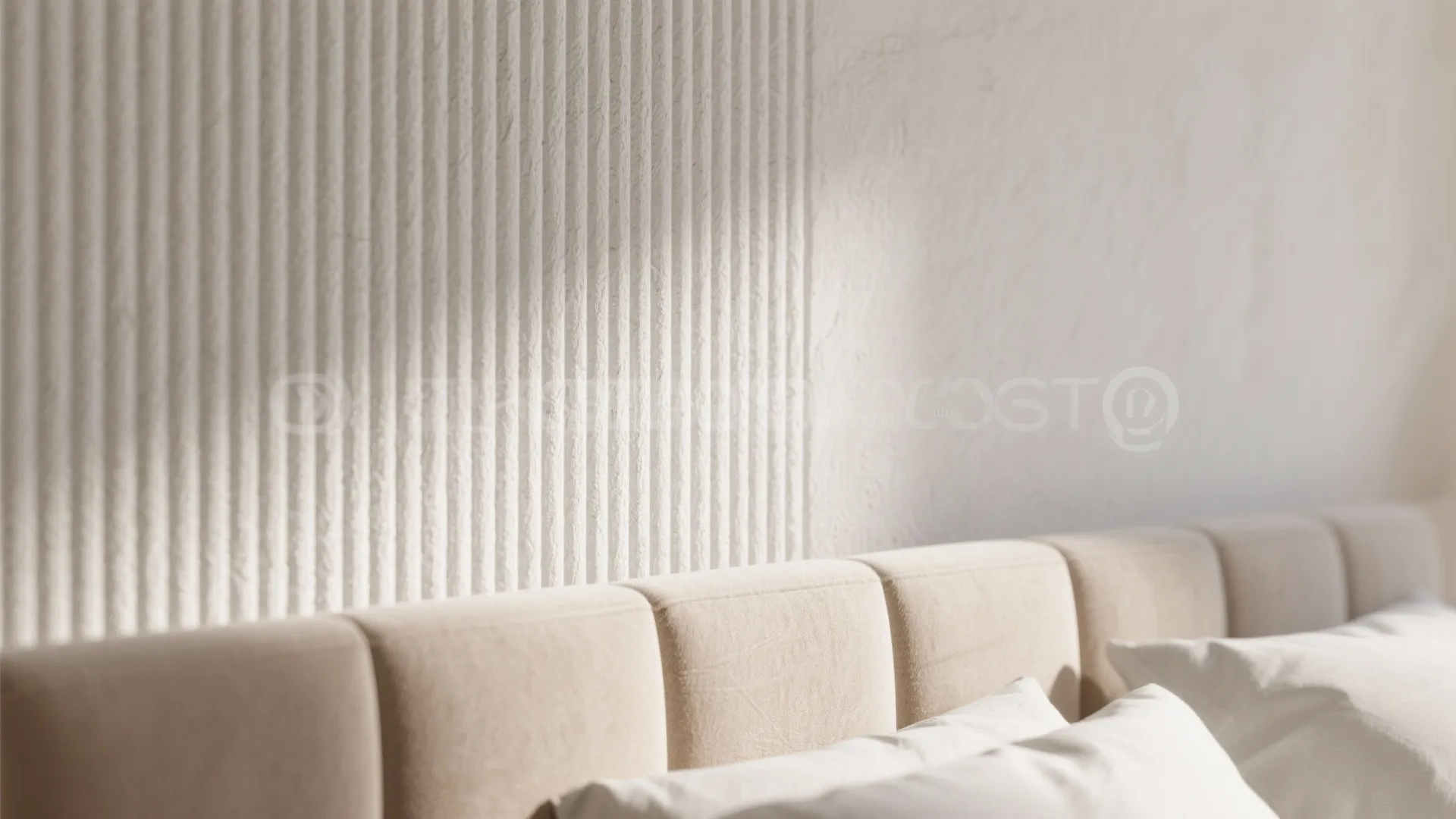 Close up of vertical wall panel texture behind soft beige bed headboard and white pillows