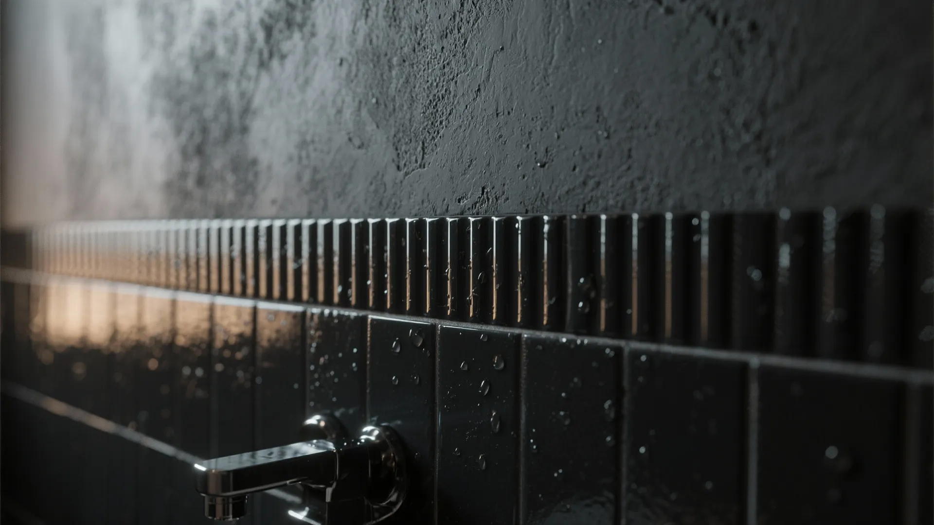 Close up view of black wall tiles with water drops and a chrome water tap