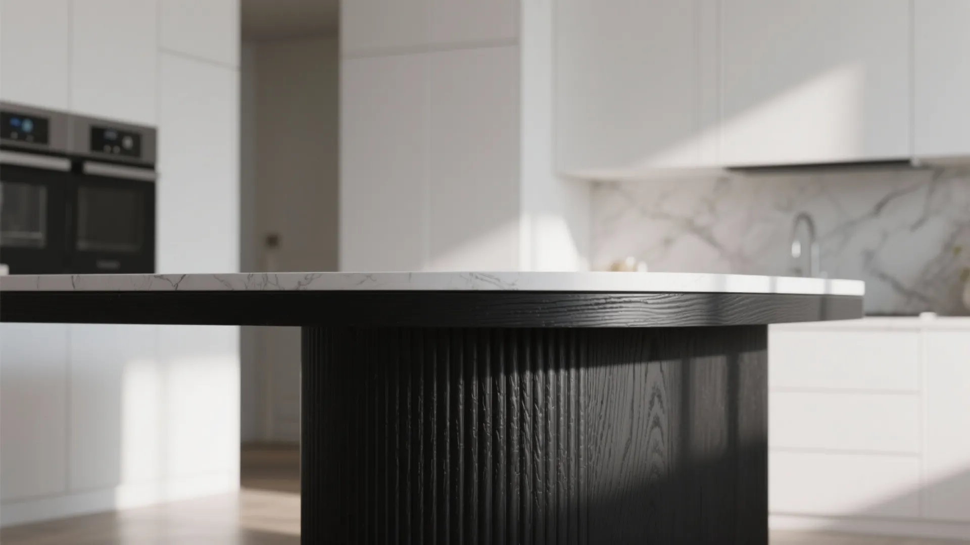 Close-up of a ribbed matte black island against white cabinets showing texture and shadow