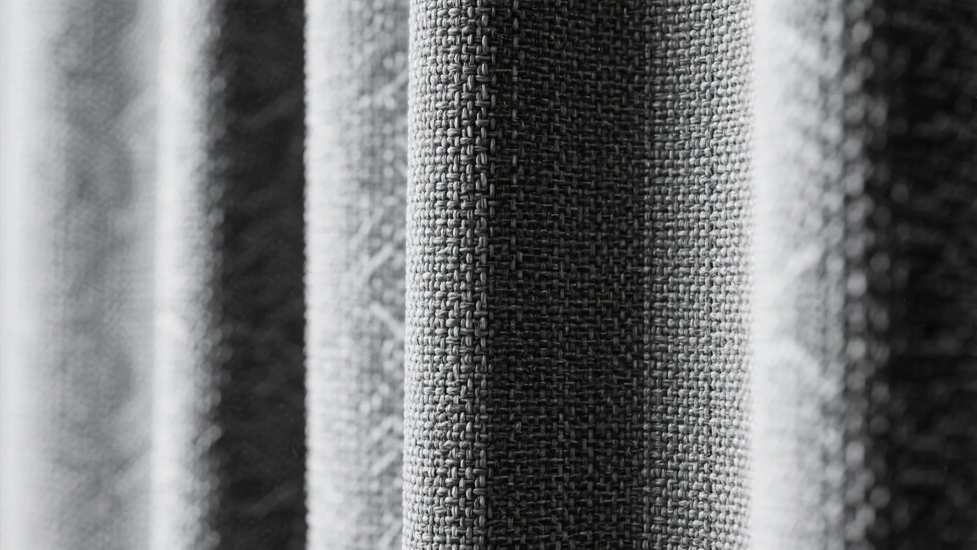 Close-up of woven black-on-white shower curtain fabric with subtle texture