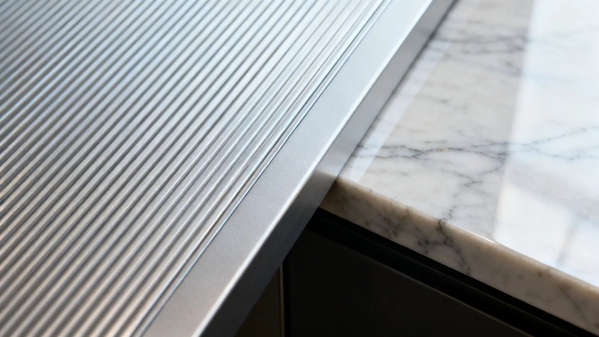 Textured aluminium panels with marble backsplash accents