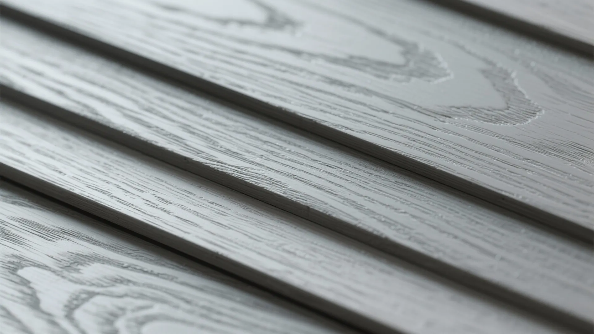 Close up view of gray textured wood panels showing detailed grain pattern and horizontal lines