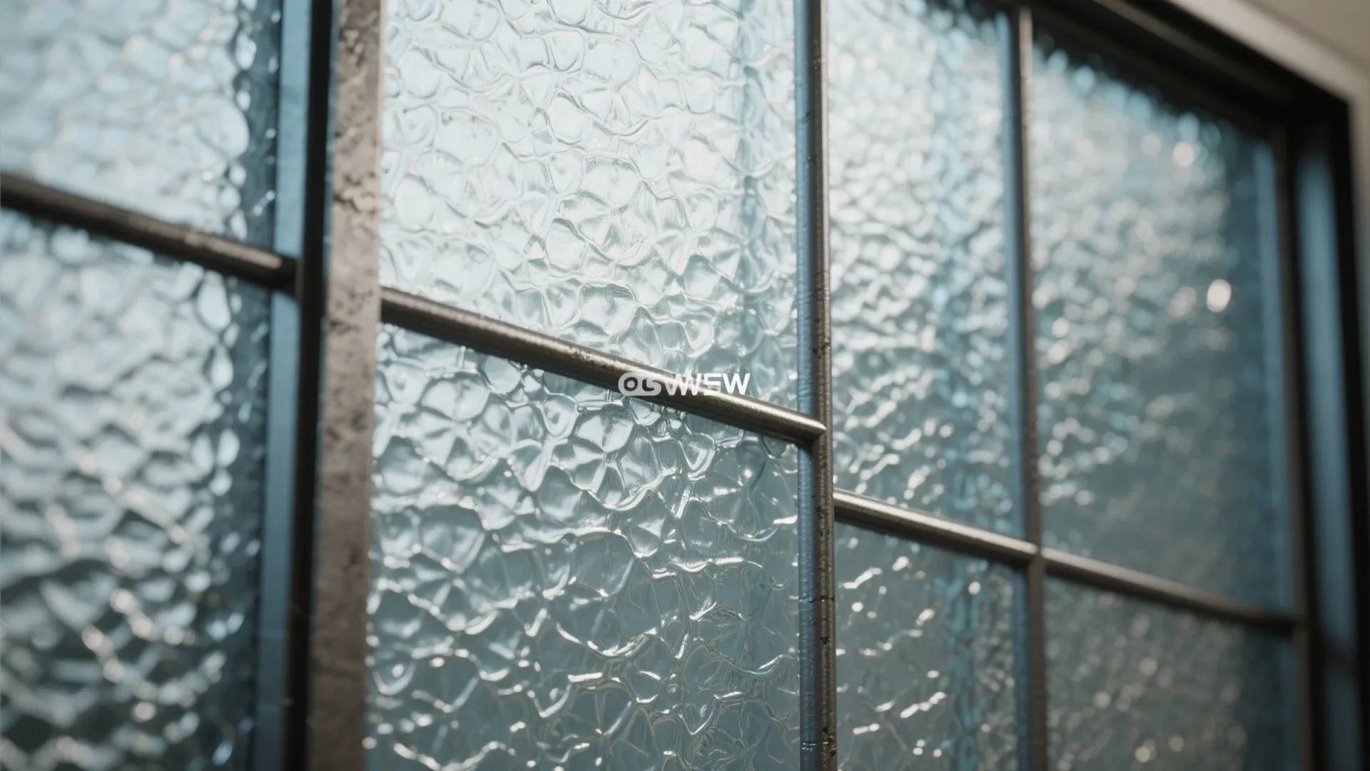 Textured glass panel with subtle metal grid framing, showing industrial charm and light diffusion.