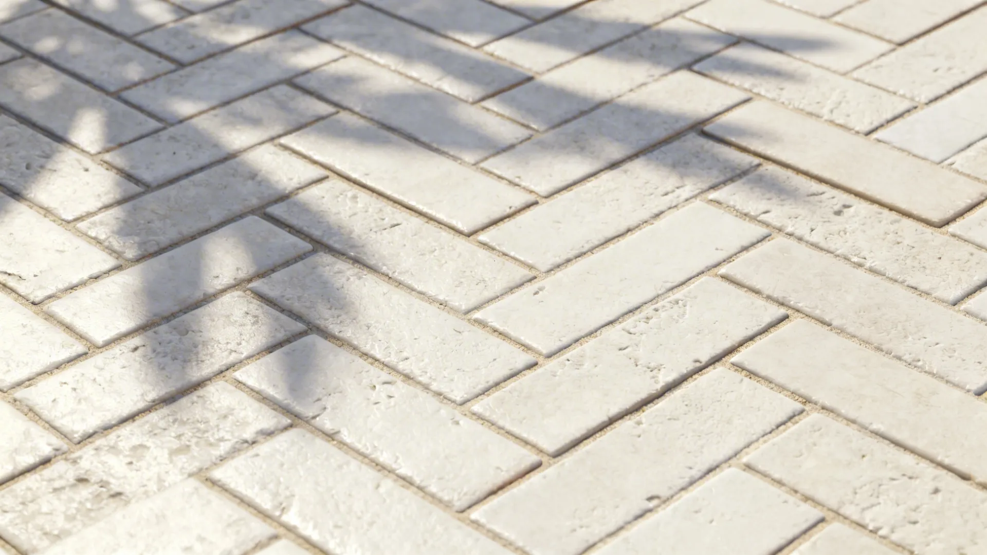 Detailed view of off-white herringbone textured tiles showing shadow and tactile depth.
